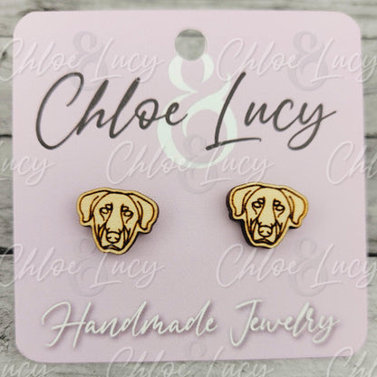 Wood dog face stud earrings on pink card labeled Handmade Jewelry