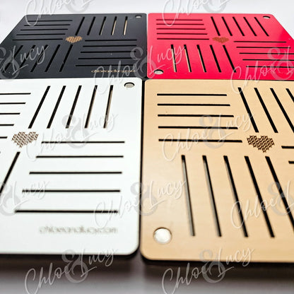 Set of four square drink coasters in black, red, white, and wood, with heart cutout design