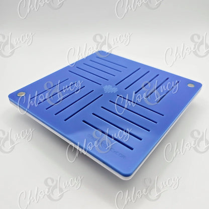 Blue silicone draining mat with slotted design and rounded holes, on white background