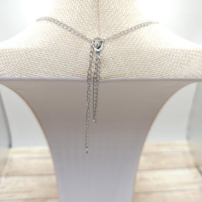 To shorten the whole necklace, loop the clasp side chain inside the clasp, and place the clasp on the other side where you'd like it to fall.